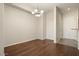 Simple dining area with hardwood floors and chandelier at 14575 W Mountain View Blvd # 11312, Surprise, AZ 85374