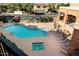 Community pool and spa area with lounge chairs at 14575 W Mountain View Blvd # 11312, Surprise, AZ 85374