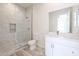 Bathroom with a walk-in shower and white cabinets at 14930 W El Cortez Pl, Surprise, AZ 85387