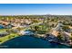 Aerial view of community lake, pool, and homes at 242 E Stonebridge Dr, Gilbert, AZ 85234
