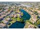 Wide aerial view of community and lake at 242 E Stonebridge Dr, Gilbert, AZ 85234