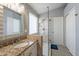 Modern bathroom with a large walk-in shower and granite vanity at 242 E Stonebridge Dr, Gilbert, AZ 85234