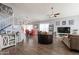 Open living room featuring hardwood floors, a ceiling fan and plenty of natural light at 242 E Stonebridge Dr, Gilbert, AZ 85234