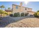 Two story house with a large backyard, covered patio, and deck at 242 E Stonebridge Dr, Gilbert, AZ 85234