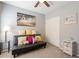 Bedroom with a sleeper sofa, decorative pillows, and a large closet at 242 E Stonebridge Dr, Gilbert, AZ 85234