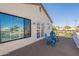 Deck with chairs and view of canal and homes at 242 E Stonebridge Dr, Gilbert, AZ 85234