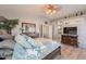 Bright bedroom with a king-size bed and ensuite bathroom access at 242 E Stonebridge Dr, Gilbert, AZ 85234