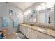 Elegant bathroom with dual sinks, granite countertops, and large mirrors at 242 E Stonebridge Dr, Gilbert, AZ 85234