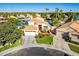 Aerial view of waterfront home with two-car garage at 242 E Stonebridge Dr, Gilbert, AZ 85234