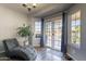 Relaxing sunroom with large windows and view of the lake at 242 E Stonebridge Dr, Gilbert, AZ 85234