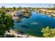 Aerial view of waterfront property with lake access at 242 E Stonebridge Dr, Gilbert, AZ 85234
