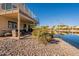 Lakefront patio with seating and outdoor grill at 242 E Stonebridge Dr, Gilbert, AZ 85234