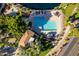 Community pool with lounge chairs and shaded areas at 242 E Stonebridge Dr, Gilbert, AZ 85234