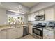 Well-equipped kitchen featuring granite countertops and stainless steel appliances at 242 E Stonebridge Dr, Gilbert, AZ 85234