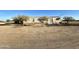 Mobile home on a spacious lot with desert landscaping at 54194 W Organ Pipe Rd, Maricopa, AZ 85139