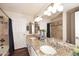 Elegant bathroom with granite countertops, double sinks, and a large mirror at 5849 E Le Marche Ave, Scottsdale, AZ 85254