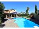 Inviting kidney-shaped pool with surrounding patio at 5849 E Le Marche Ave, Scottsdale, AZ 85254