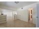 Open living room with built-in shelving and tile floors at 6841 N 15Th Pl, Phoenix, AZ 85014