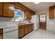 Kitchen features wood cabinets, double oven, and tile floors at 6841 N 15Th Pl, Phoenix, AZ 85014