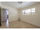 Bright bedroom with tile flooring and a view of the backyard at 6841 N 15Th Pl, Phoenix, AZ 85014