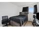 Bedroom with full-size bed, dresser, and chair at 8221 E Garfield St # L09, Scottsdale, AZ 85257