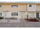 Attractive exterior with stone pathway and landscaping at 8221 E Garfield St # L09, Scottsdale, AZ 85257