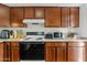 Kitchen boasts wood cabinets, granite countertops and appliances at 8221 E Garfield St # L09, Scottsdale, AZ 85257