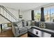 Spacious living room with sectional sofa, coffee table and large window at 8221 E Garfield St # L09, Scottsdale, AZ 85257