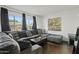 Living room with sectional sofa, coffee table, and large artwork at 8221 E Garfield St # L09, Scottsdale, AZ 85257