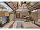 Backyard patio with covered pergola, grill, and storage shed at 8221 E Garfield St # L09, Scottsdale, AZ 85257