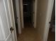 Hallway with doors to bedrooms and bathroom at 25176 W Cranston Ln, Buckeye, AZ 85326