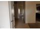 Bright hallway with tile flooring and access to rooms at 25176 W Cranston Ln, Buckeye, AZ 85326