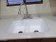 Double kitchen sink with modern faucet and light-colored countertop at 25176 W Cranston Ln, Buckeye, AZ 85326