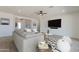 Inviting living area with comfortable seating, a large TV, and ample natural light at 4550 N 192Nd Dr, Litchfield Park, AZ 85340