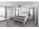 Spacious main bedroom with upholstered bed and ceiling fan at 4636 E Tierra Buena Ln, Phoenix, AZ 85032