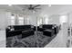 Open living area with sectional sofa, large rug, and view to dining area at 4636 E Tierra Buena Ln, Phoenix, AZ 85032