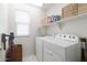 Laundry room with washer, dryer, and shelving at 4636 E Tierra Buena Ln, Phoenix, AZ 85032