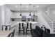 Modern kitchen with white cabinets, island, and black and white accents at 4636 E Tierra Buena Ln, Phoenix, AZ 85032