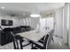 Bright dining area with a large table and modern pendant lighting at 4636 E Tierra Buena Ln, Phoenix, AZ 85032