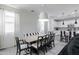 Dining area with black and white striped bench and adjacent kitchen at 4636 E Tierra Buena Ln, Phoenix, AZ 85032