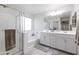 Bathroom with double vanity, soaking tub, and shower at 4636 E Tierra Buena Ln, Phoenix, AZ 85032