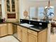 Well-equipped kitchen with granite counters, custom cabinets, and breakfast bar at 2222 N Val Vista Dr # 3, Mesa, AZ 85213