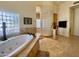 Spa-like bathroom with a large soaking tub and glass block shower at 2222 N Val Vista Dr # 3, Mesa, AZ 85213