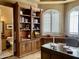 Home office with built-in shelves and bathroom access at 2222 N Val Vista Dr # 3, Mesa, AZ 85213