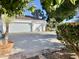 Three-car garage with white doors and terracotta roof at 2222 N Val Vista Dr # 3, Mesa, AZ 85213