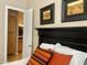 Bedroom with adjacent bathroom access and artwork at 2222 N Val Vista Dr # 3, Mesa, AZ 85213