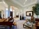 Spacious living room with a piano, comfortable seating and large windows at 2222 N Val Vista Dr # 3, Mesa, AZ 85213