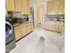 Laundry room with light wood cabinets, a utility sink, and a washer and dryer at 2222 N Val Vista Dr # 3, Mesa, AZ 85213