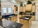 Open kitchen with two islands, granite counters, and stainless steel appliances at 2222 N Val Vista Dr # 3, Mesa, AZ 85213