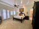 Bright bedroom with a comfortable bed and French doors leading to the outdoors at 2222 N Val Vista Dr # 3, Mesa, AZ 85213